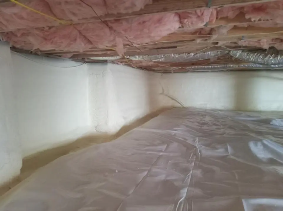 Crawl space encapsulation with closed-cell spray foam for Storm Damage Roof Repair in Stowe